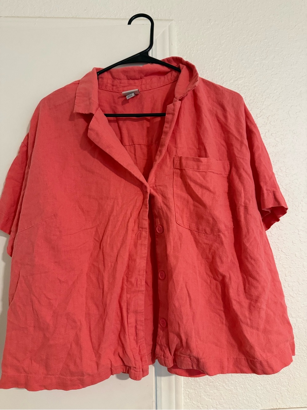 A New Day women’s coral pink short-sleeve button-up shirt.
